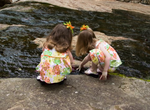 two girls playing having three kids