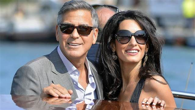 George Clooney and Amal Alamuddin arrive in Venice. Via: Getty Images