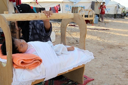 A displaced Iraqi woman at a camp for internally displaced persons. PHOTO/ALI AL-SAADI        (Photo: ALI AL-SAADI/AFP/Getty Images)