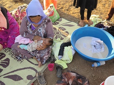 A Yezedi woman and her baby in northern Iraq. (Photo: Amnesty International.)