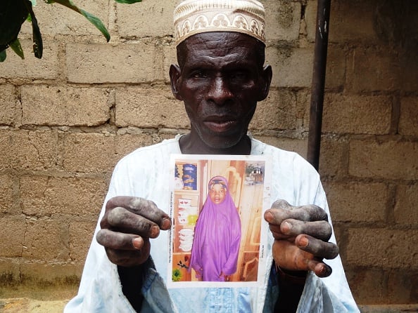 Sani Garba, 55, holds the picture of his 14-year-old daughter-in-law Wasila Tasi'u (Photo: AMINU ABUBAKAR/AFP/Getty Images)View similar imagesMore from this photographerDownload comp NIGERIA-CHILDREN-ISLAM-TRIAL Credit: AMINU ABUBAKAR / Stringer Caption:
