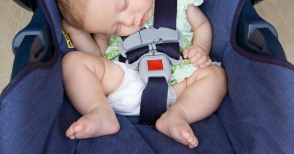 infant sleeping in bouncer