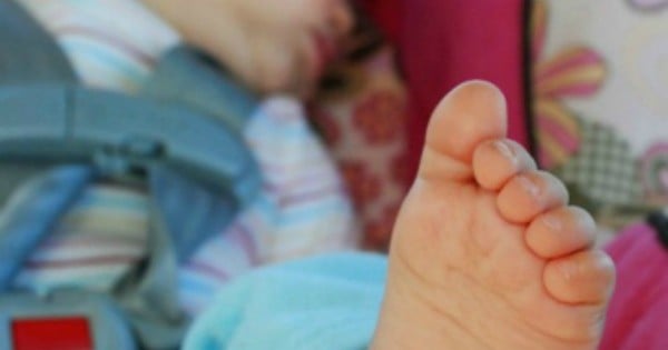 newborn sleeping in bouncer