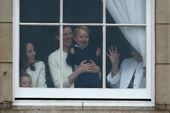 LONDON, ENGLAND - JUNE 13:  Prince George of Cambridge is held by his nanny Maria Teresa Turrion Borrallo as he waves from the window of Buckingham Palace as he watches the Trooping Tthe Colour on June 13, 2015 in London, England. . The ceremony is Queen Elizabeth II's annual birthday parade and dates back to the time of Charles II in the 17th Century when the Colours of a regiment were used as a rallying point in battle.  (Photo by Chris Jackson/Getty Images)