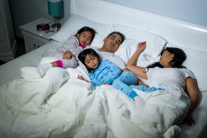 Kids and parents sleeping.