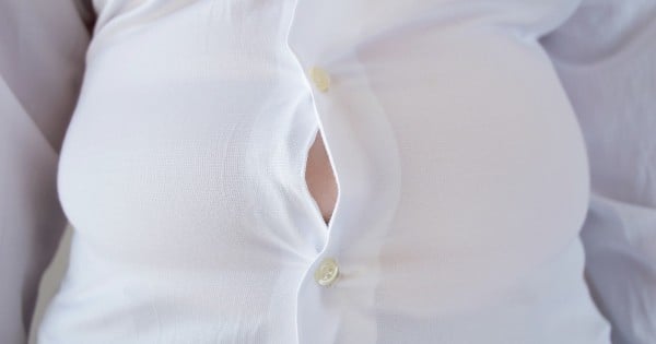 close up of a woman with little shirt for being fat