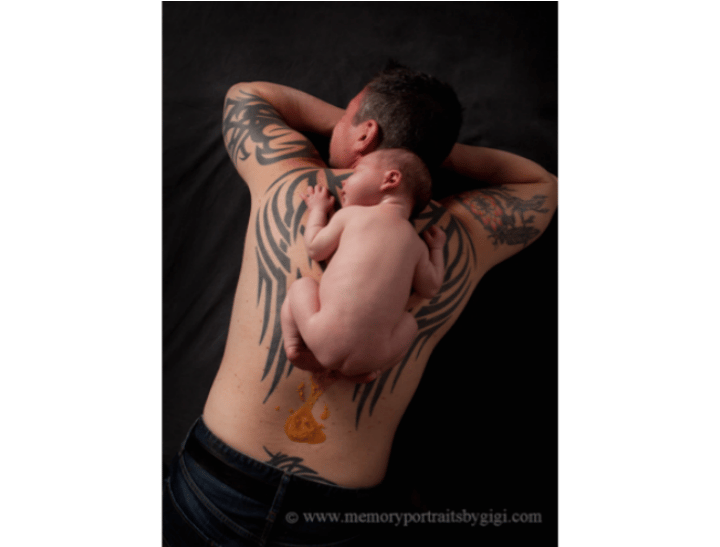 Baby Asher on his Dads back just after the "accident" occurred. Image supplied.