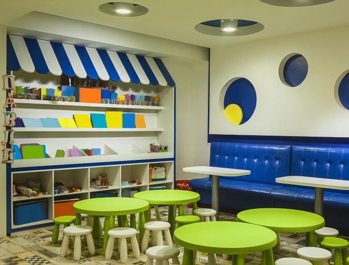 Modern kindergarten interior, details of toys and equipment, colorful room design.
