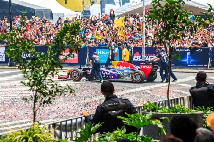 Staff of the Infiniti Red Bull Racing Team takes the cars back to the trailers, at the Infiniti Red Bull Racing F1 Showrun.