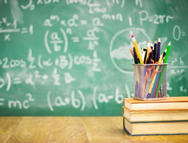Books and blackboard, school supplies, back to school