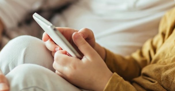 mother-and-son- social using-a-smart-phone