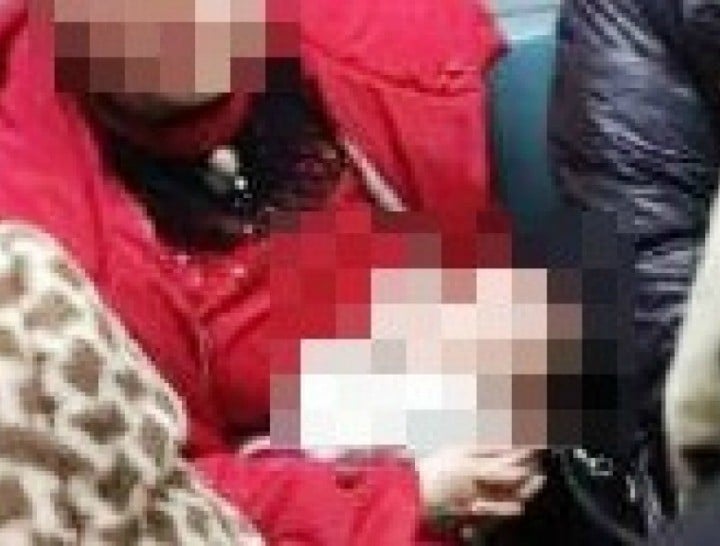 chinese woman breastfeeding on train pixelated 720x547