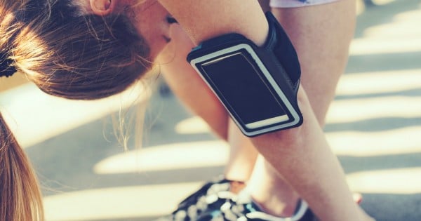 woman exhausted after exercise wearing ipod