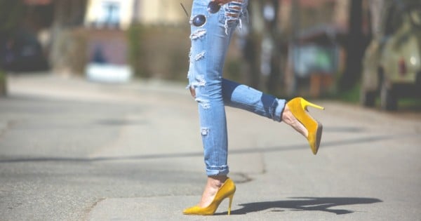 Sexy legs in yellow high heels