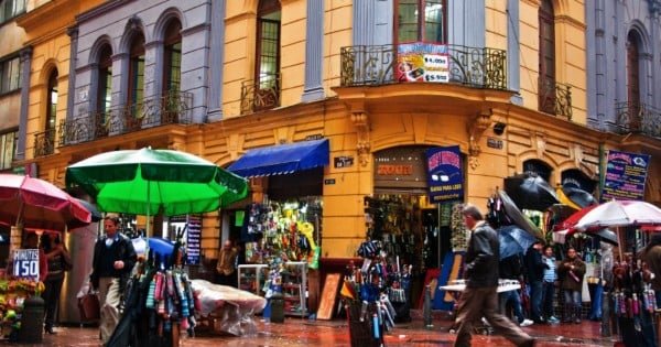 BOGOTA, COLOMBIA - JANUARY 27: People pass by a busy street corner in Bogota, Colombia on January 27, 2012