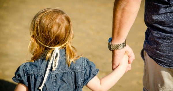 girl holding hand man