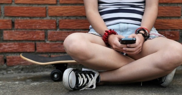 girl on phone istock