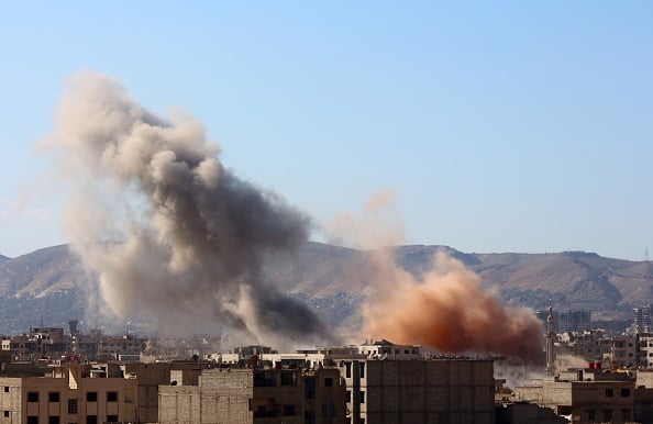 DAMASCUS, SYRIA - FEBRUARY 26: Smoke rises after the war crafts belonging to the Russian army carried out airstrikes on the residential areas in the town of Arbin in the Eastern Ghouta region of Damascus, Syria on February 26, 2016. (Photo by Diaa Al-Din/Anadolu Agency/Getty Images)