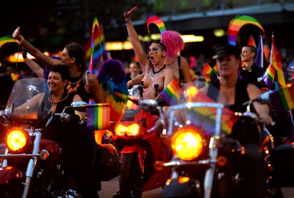 'Dykes on Bikes' (DOB) take part during the Sydney's annual gay and lesbian Mardi Gras night parade on March 1, 2013. Some 10,000 revellers on 144 individual floats marked the journey down Oxford Street, hub of Sydney's gay and lesbian nightlife, in a vibrant show featuring drag queens, political parodies and plenty of glitter. AFP PHOTO / SAEED KHAN (Photo credit should read SAEED KHAN/AFP/Getty Images)