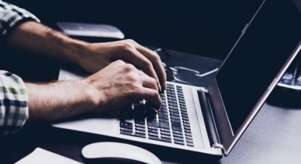 Man's hands typing