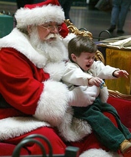 There has been a call to ban kids sitting on Santa’s knee.