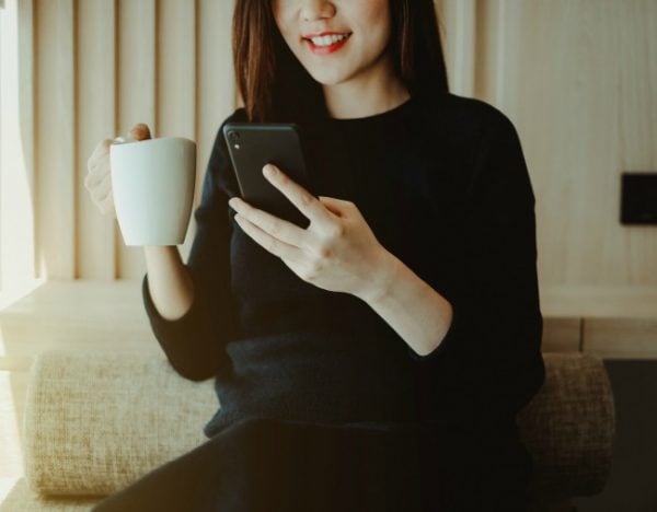 woman reading from phone