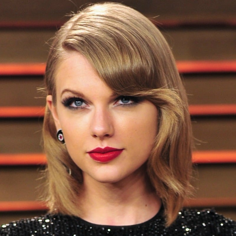 taylor swift red lipstick bangs