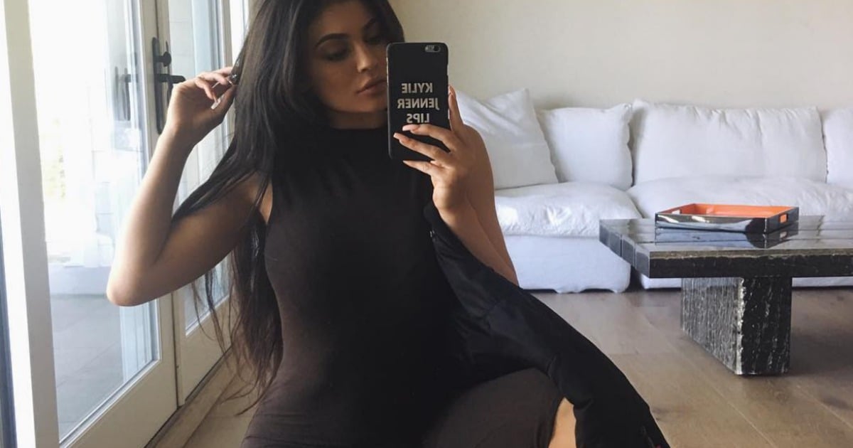 The Kylie Jenner arm raise is the trademark pose we never noticed.