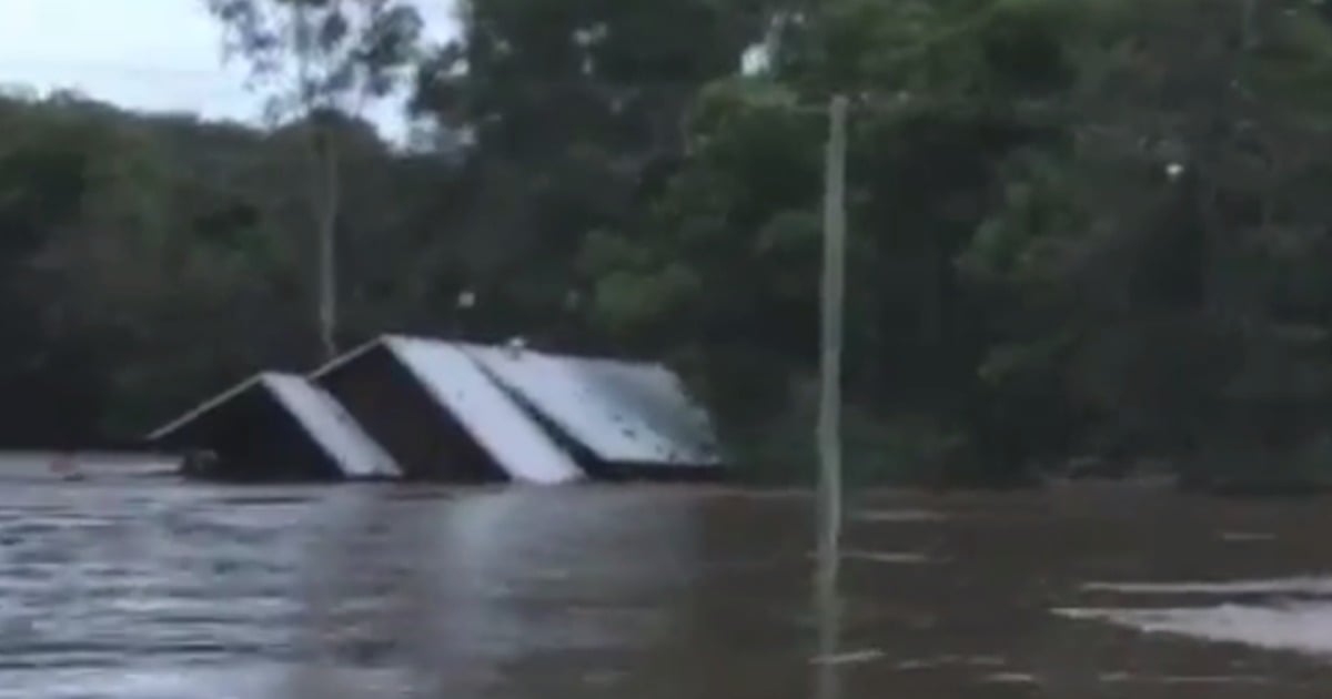 floodwaters sweep away house