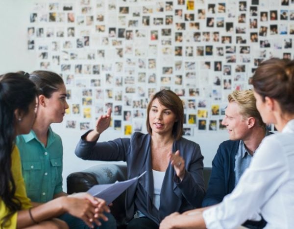businesswoman-leading-casual-meeting