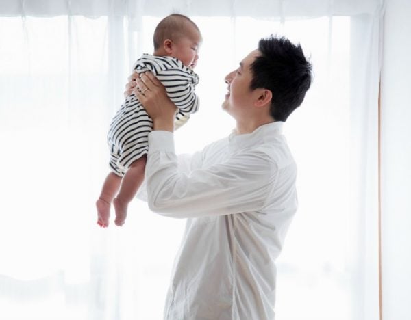 man-holding-baby