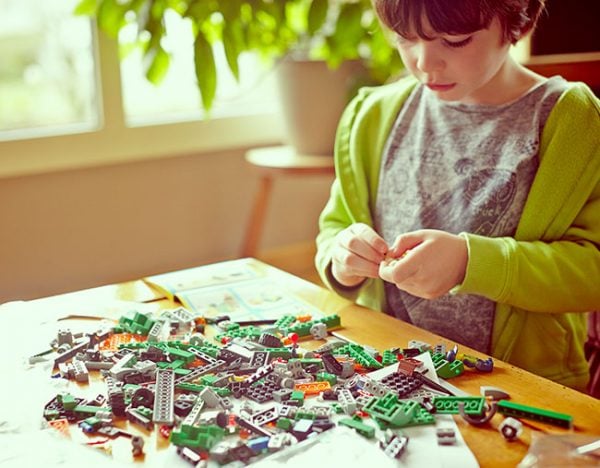 boy playing with lego