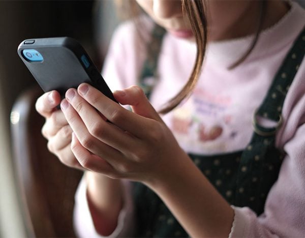young girl on iphone smartphone