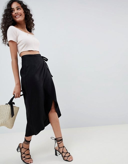Everybody will be wearing this silk midi skirt this summer. Shop one here.