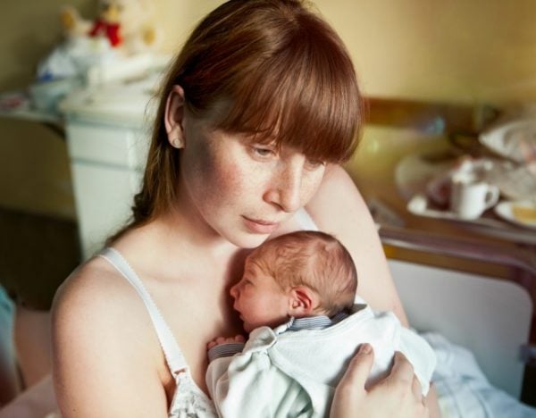 mother holding baby