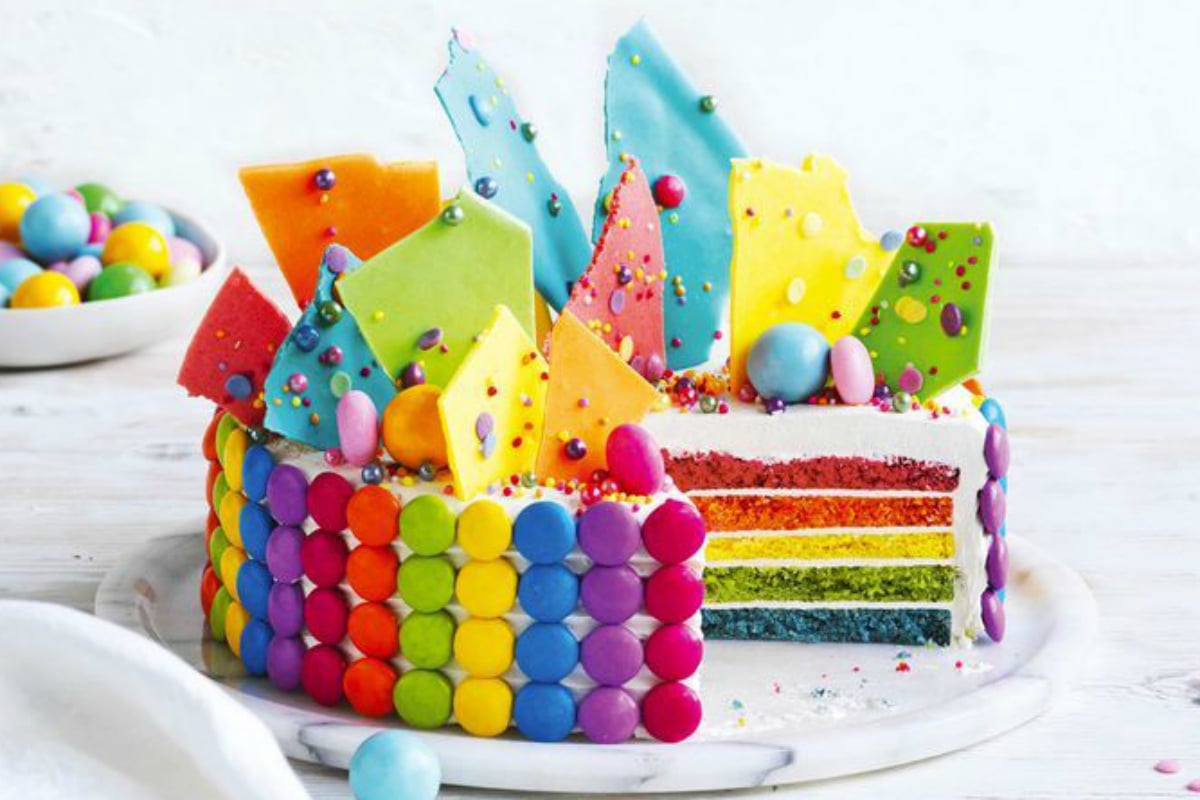 The $16 Coles Rainbow cake becomes fancy quickly for a kids' birthday.