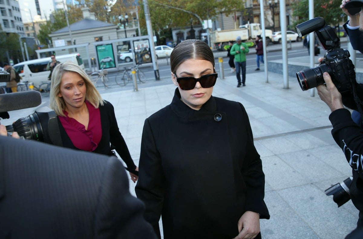 Belle Gibson home raided in Melbourne over unpaid fines.