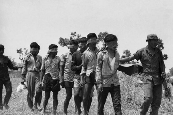 Men led to execution. Image via Wiki Commons.